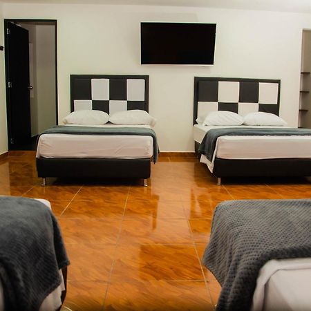 Casa Hotel Los Arboles Bello Bagian luar foto